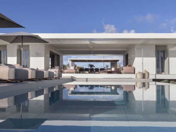 The two wings and central, communal terrace of Amira seen from the splendid pool.