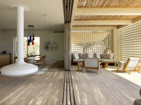 A wall of fully extendable sliding glass doors in the communal hub blurs the lines between indoors and out.