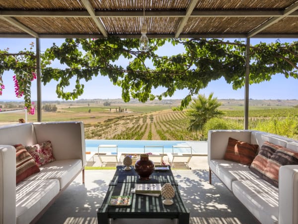 The sea views and the pool from Angheli's main shady terrace.